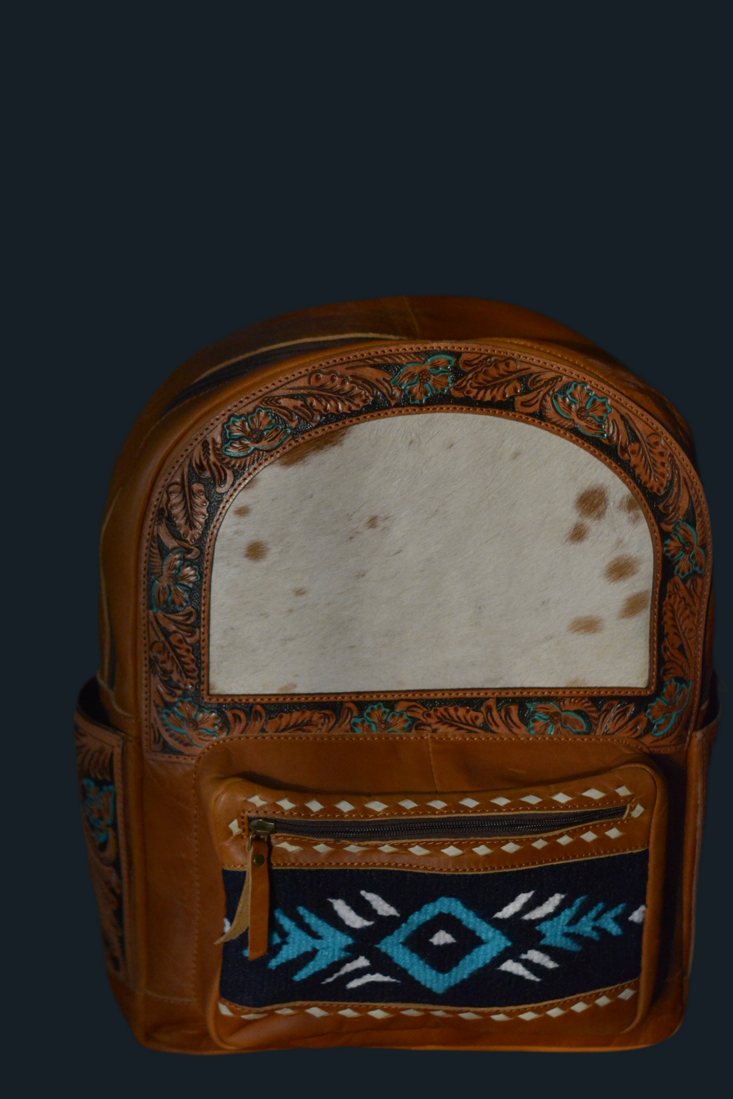 Tooled horse blanket and hide backpack