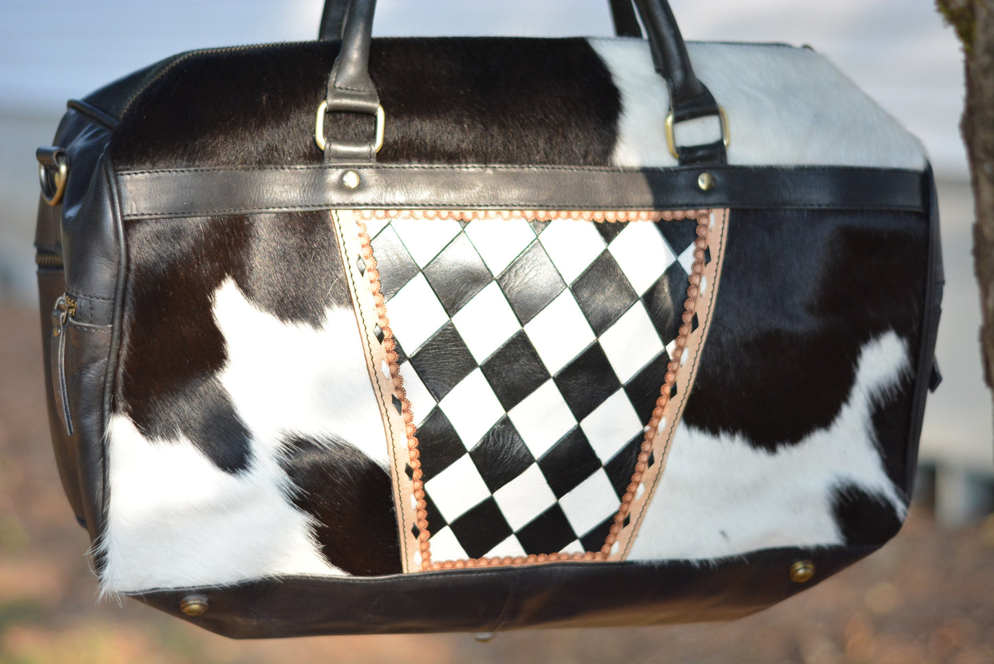 Tooled checker black cowhide duffle bag