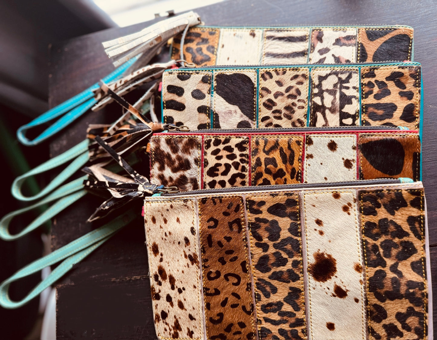 wild patch wristlet - cowhide with animal printed patterns