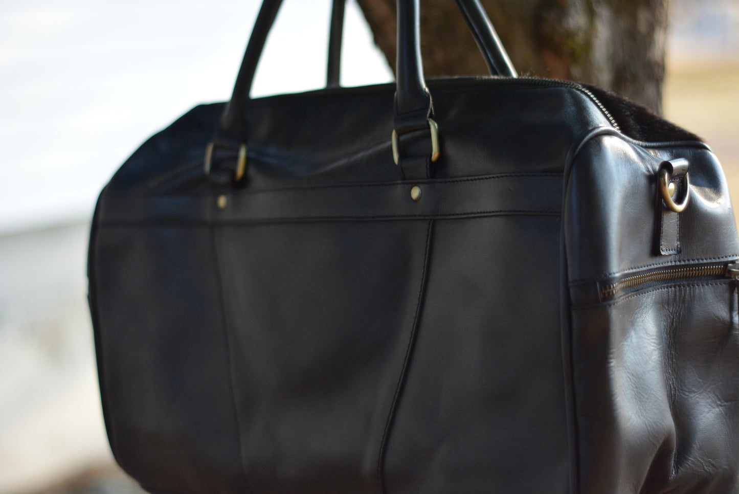 Tooled checker black cowhide duffle bag