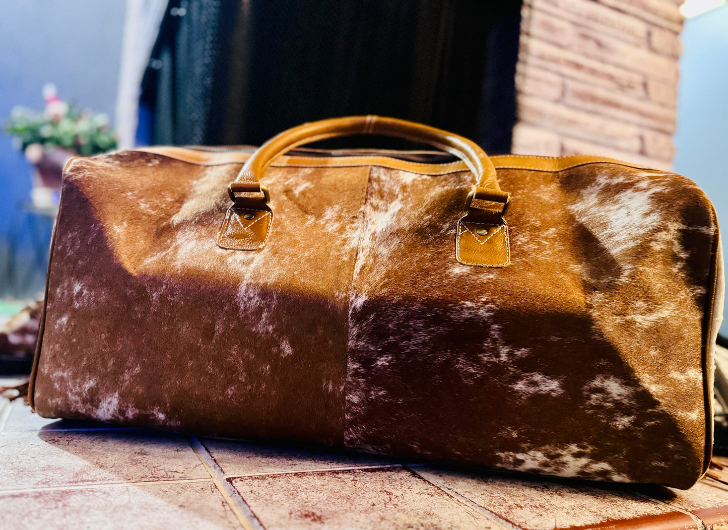 Tooled cowhide fringe duffle bag