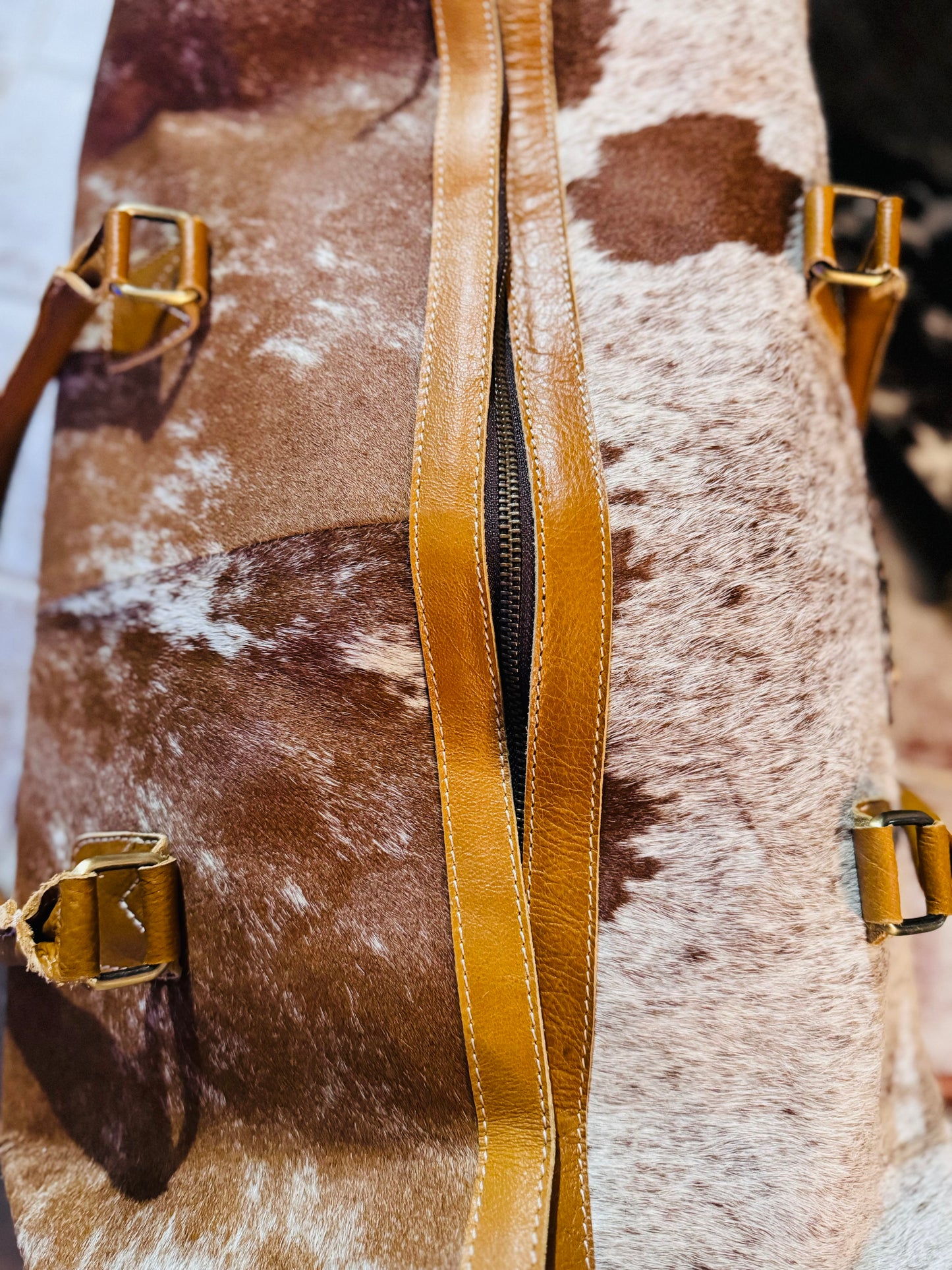 Tooled cowhide fringe duffle bag