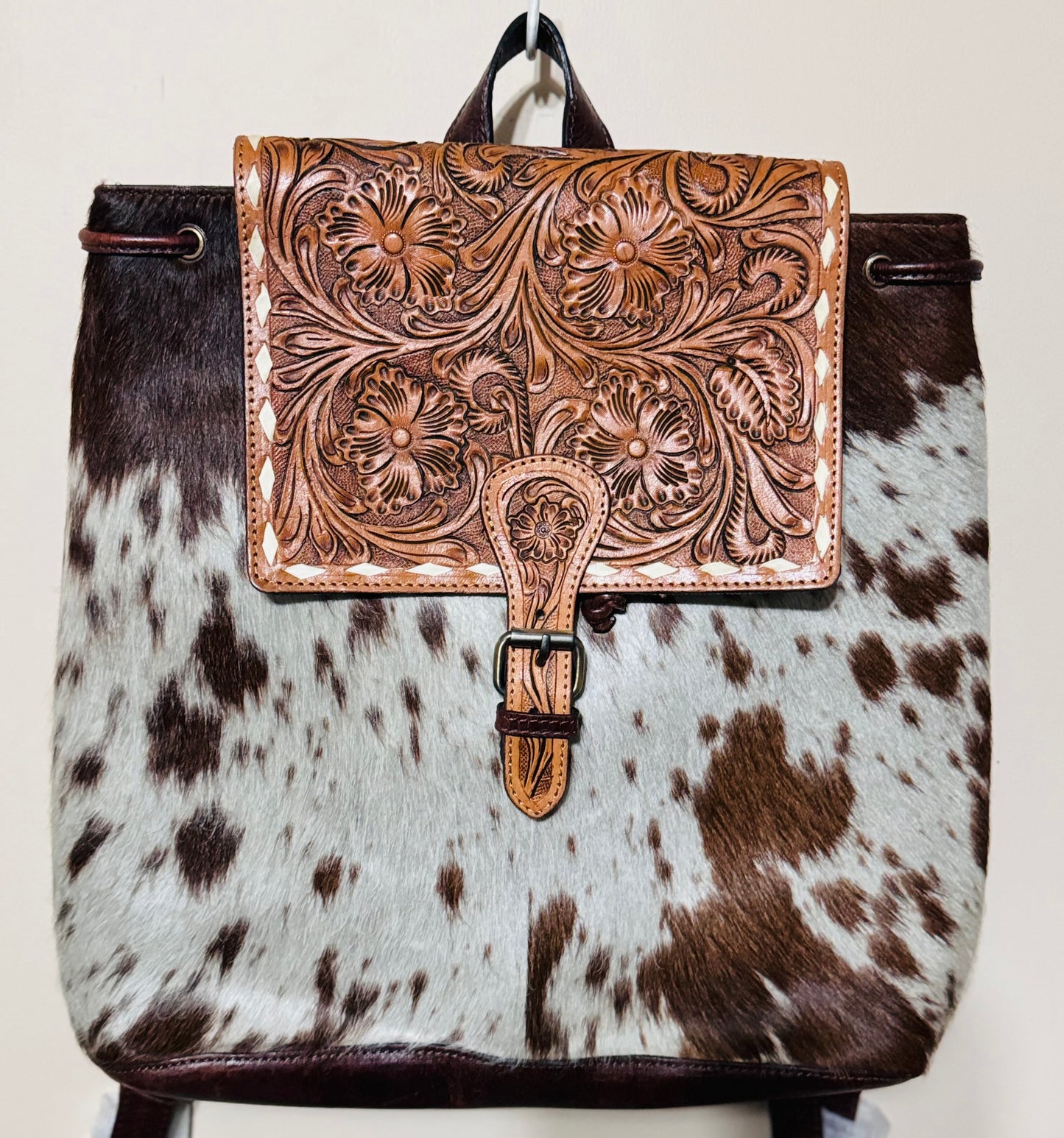 Rustic elegance tooled cowhide backpack