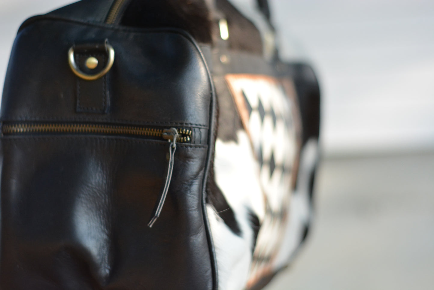 Tooled checker black cowhide duffle bag