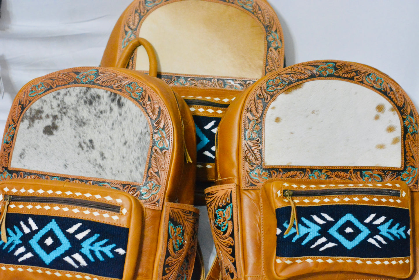Tooled horse blanket and hide backpack