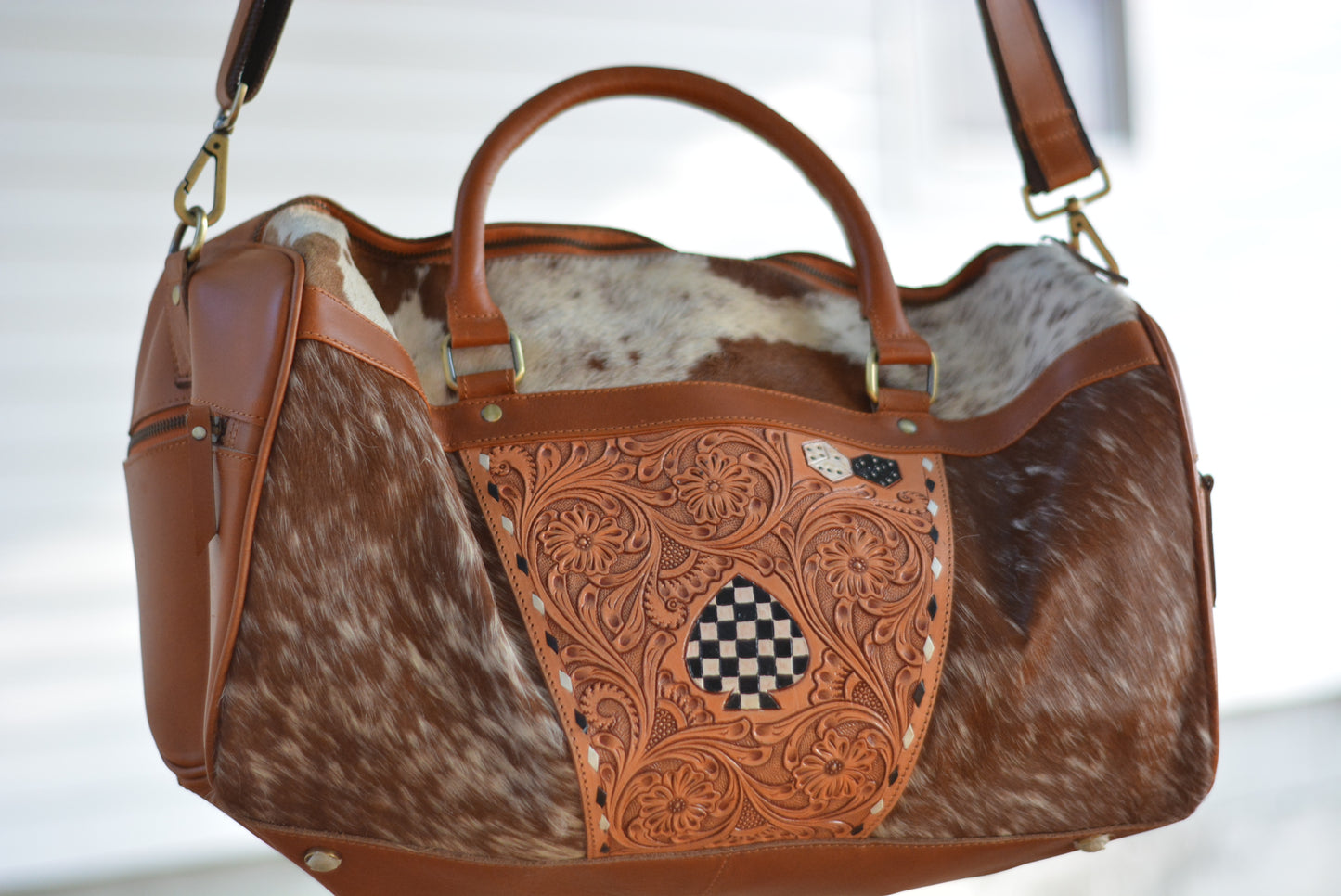 Tooled checker cowhide duffle bag