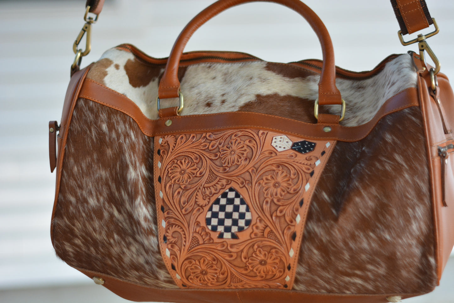 Tooled checker cowhide duffle bag